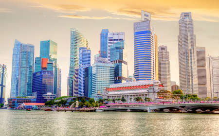 Golden sunset over Singapore skyline at downtown financial business district as seen on Marina Bay. HDR rendering.のeditorial素材