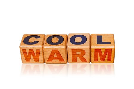 Cool and Warm on the same alphabet blocks with cool and warm colored text. Concept of temperatures, attitudes or emotions.の写真素材