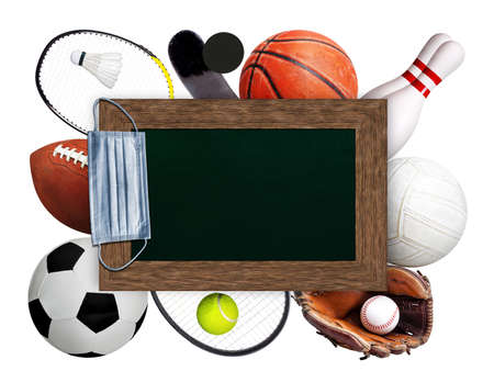 Framed chalkboard copy space with hanging medical face mask on top of sports balls and equipment on white background. Concept of sports during pandemic.の写真素材