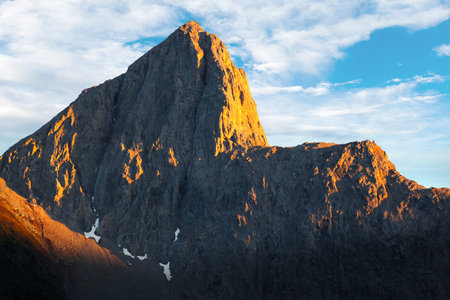 Golden sunset over The Wedge, a distinctive mountain peak named for its similarity to a carpenter's...