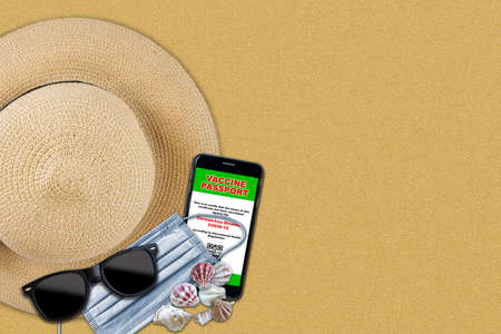 New normal travel vaccine passport concept of pandemic vacation on beach setting with straw hat, sunglasses, face mask and proof of vaccination on smart phone with copy space.の写真素材