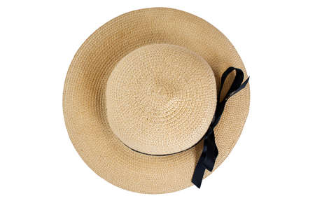 Top down view of straw hat with black bow ribbon isolated on white background. Popular summer beach and vacation casual wear.の写真素材
