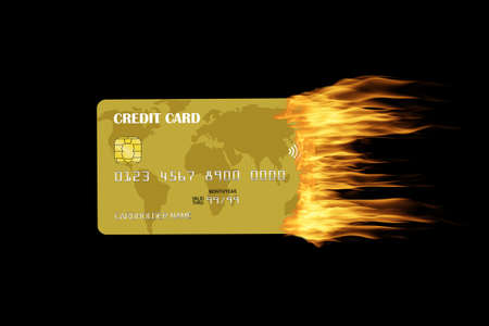 Golden credit card burning with trailing fire isolated on black background. Concept of credit trouble, financial crisis, credit warning, debt, late and missed payments.の写真素材