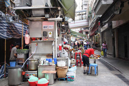 HONG KONG - APR. 19, 2011: Unique open-air street food stalls known as Dai Pai Dong in Hong Kong Central. These outdoor kitchens are now a Hong Kong heritage and culture.のeditorial素材