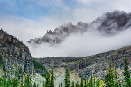 Heavy clouds cover the mountains of Lake O'Hara in the Canadian Rockies of Yoho National Park, British Columbia, Canada.の写真素材