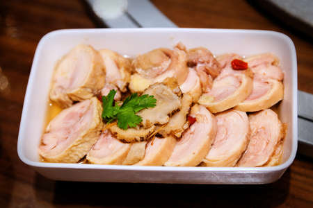 Famous Shanghai Chinese cuisine known as drunken chicken is a dish of steamed chicken that has been soaked in Shaoxing wine and served cold as an appetizer.の写真素材
