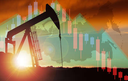 Pump jack silhouette against a sunset sky with Russian map and declining stock chart background. Concept of depletion or declining oil production and gas industry or falling oil prices in Russia.の写真素材