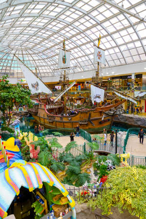 EDMONTON, CANADA - APRIL 16, 2022: Shoppers visit the West Edmonton Mall in Alberta, Canada. At 5.3 million sq ft, it is the second largest shopping mall in North America.のeditorial素材