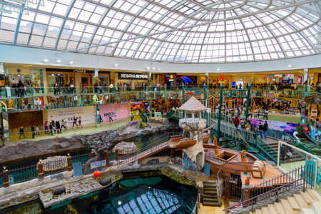 EDMONTON, CANADA - APRIL 16, 2022: Shoppers visit the West Edmonton Mall in Alberta, Canada. At 5.3 million sq ft, it is the second largest shopping mall in North America.のeditorial素材