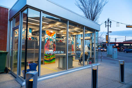 EDMONTON, CANADA - APRIL 17, 2022: A women's glass-walled public washroom on Whyte Avenue. It was built in 2012 to stem a foul tide of public urination complaints plaguing the area's popular Edmonton nightlife destination that has become a tourist attractのeditorial素材