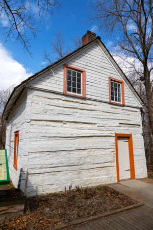 EDMONTON, CANADA - APRIL 17, 2022: The first 1875 house of John Walter at the John Walter Museum in Edmonton, Alberta. The site interprets the life of John Walter and his important contribution to the community of Walterdale from 1870-1942.のeditorial素材