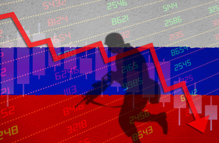 War causing economic crisis with stock market chart arrow down in red negative territory over Russian flag painted on wall with shadow of soldier. Economy problem due to Russian invasion in Ukraine.の写真素材