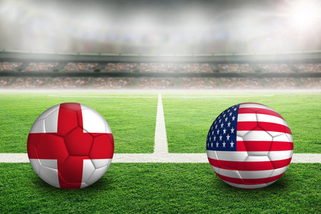 England vs United States football in brightly lit outdoor stadium with painted English and US flags. Focus on foreground and soccer ball with shallow depth of field on background and copy space.の写真素材