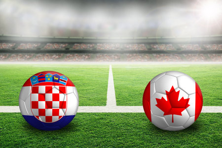 Croatia vs Canada football in brightly lit outdoor stadium with painted Croatian and Canadian flags. Focus on foreground and soccer ball with shallow depth of field on background and copy space.の写真素材