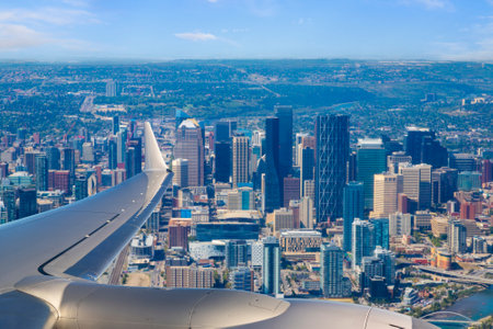Aerial view of Calgary downtown skyline from window of airplane as it approaches Calgary airport for landing in the Summer.の写真素材