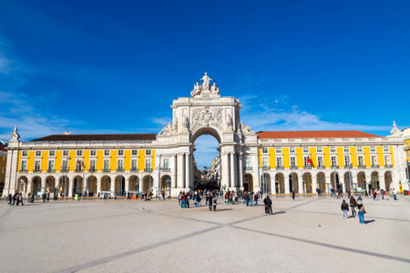 Unidentifiable visitors mingling at historic Praca do Comercio or Commerce Square with Rua Augusta Arch in Lisbon. Portugalの写真素材