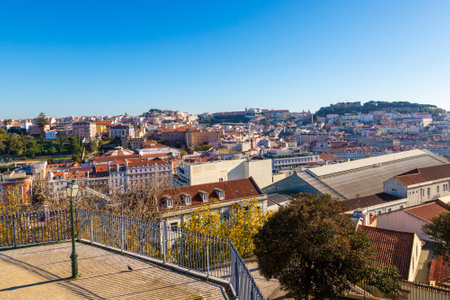 Lisbon skyline as seen from the popular terrace viewpoint of Miradouro de SÃ£o Pedro de AlcÃ¢ntara, with views of Baixa, Mouraria and Saint George's Castle.の写真素材