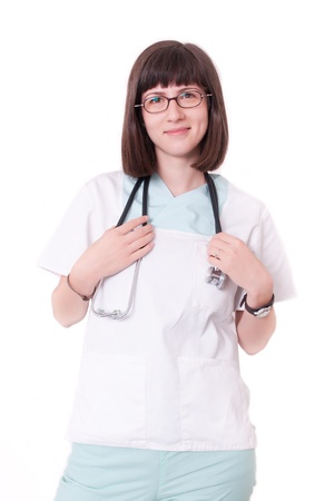 Young female doctor smiling in white uniformの写真素材