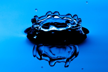 Water drop in motion shoot with blue lightingの写真素材