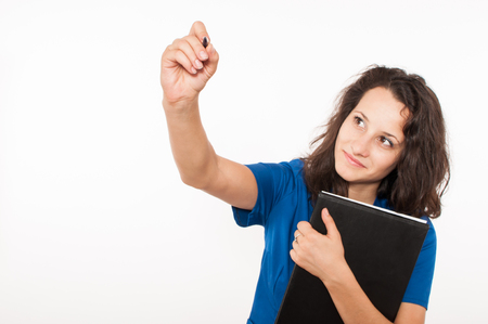 Young female doctor in blue coat writingの写真素材