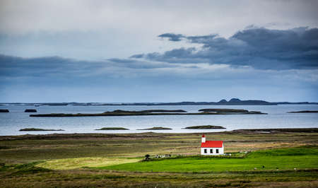 Iceland, Westfiords and lonely church in the green landscapeの写真素材