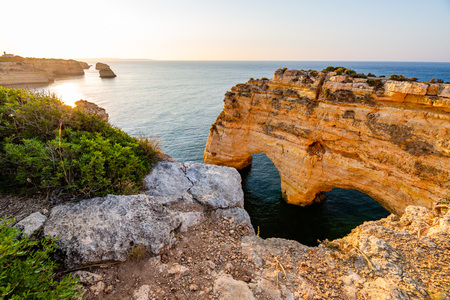 Praia da Marinha, Algarve, Portugal. Sunrise and heart shaped rockの写真素材