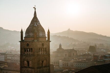 Bologna, cityscape and buildings at sunset, San Pietro Cathedral Bell Tower and San Luca hill. Emilia Romagna, Italyの写真素材