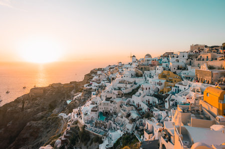 The village of Oia on Santorini island in Greece at sunsetの写真素材