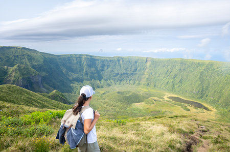 Hiker admires the Sete Cidades caldera view in Sao Miguel, Azores.の写真素材