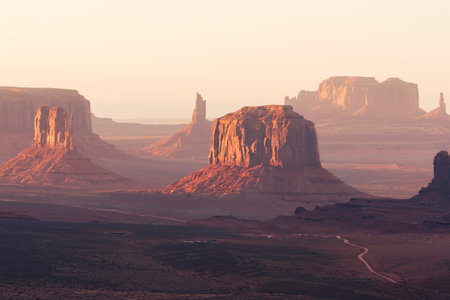 Monument Valley at sunrise, showcasing iconic mesas and buttesの写真素材