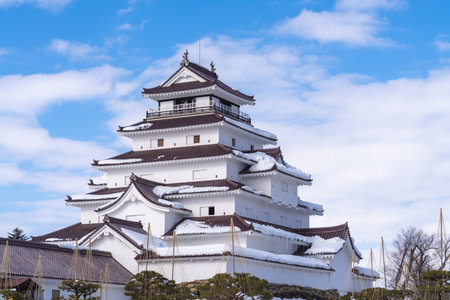 Aizuwakamatsu Castle Tsuruga Castle stands snow-covered on a clear winter dayの写真素材