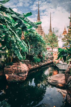 Grand Palace in Bangkok. Towers of Grand Palace reach into the Sky. Little lake inside the temple. Different view on this tourist attraction.のeditorial素材