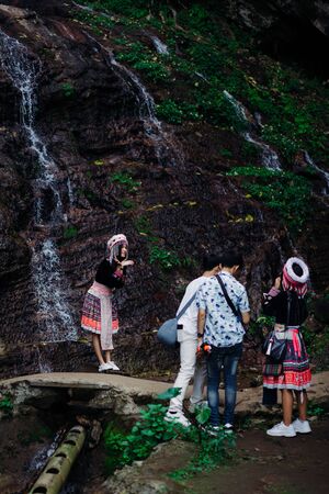 Doi Pui Tribal Village, Chiang Mai, Thailand, 12.16.18: Asian tourist dress up in traditional clothing of the Hmong tribe to take vacation snapshots.のeditorial素材