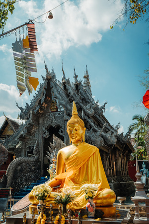 Silver Temple in Chiang Mai. Outside view. No women allowed to entry the temple. Golden Buddha outside the Silver Templeの写真素材