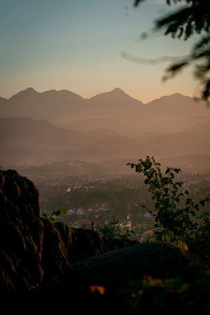 Beautiful clouds over the city. Mountains in the background. Amazing blue sky. Perfect condition.の写真素材
