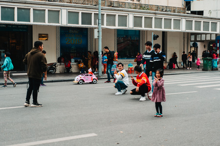 Hanoi, Vietnam, 12.20.18: Life in the street in Hanoi. Boyband films their music video in the middle of the streetのeditorial素材