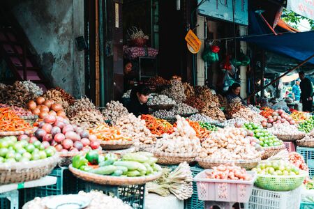 Hanoi, Vietnam, 12.20.18: Life in the street in Hanoi. Vendors try to sell their goods in the busy streets of Hanoiのeditorial素材