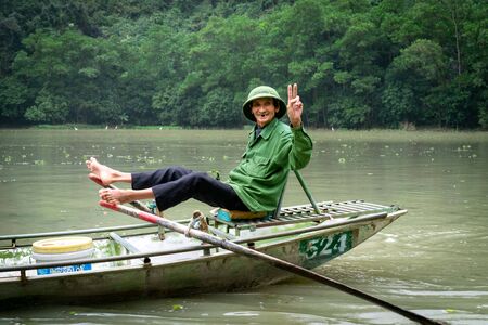 Tam Coc, Vietnam 1.1.19: Beautiful landscape with rocks and rice fields in Ninh Binh and Tam Coc in Vietnam. Famous boats on the riverのeditorial素材