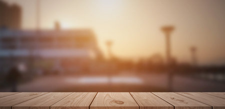 Empty light wood table top on blurred background