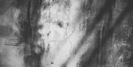 Black concrete wall or dark gray rough grainy stone texture background.