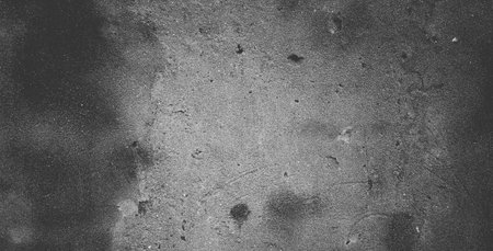 Black concrete wall or dark gray rough grainy stone texture background.
