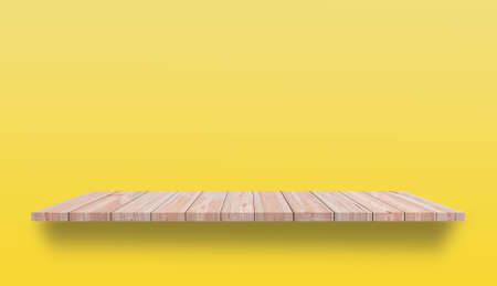 Empty Wooden table can be used for present products yellow background.の写真素材