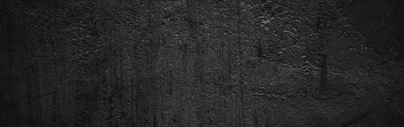 Panoramic Scary dark walls, slightly light black concrete cement texture for backgroundの写真素材