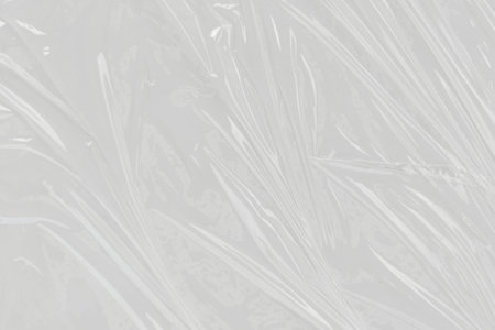 Plastic wrinkled, white plastic or polyethylene bag texture, macro, white backgroundの写真素材