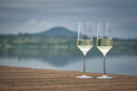 Two glass of champagne in the rainの写真素材