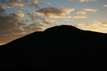 Sunset dusk behind California hill golden hour copy spaceの写真素材