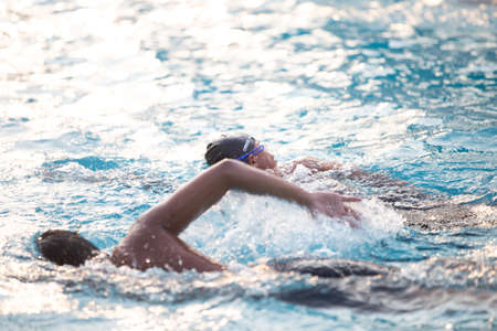 Jakarta, Indonesia - 10.11.2018 A theacher is training students to swimのeditorial素材