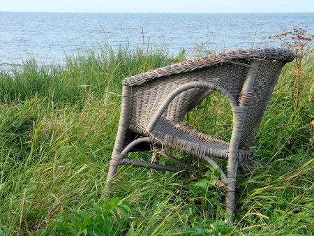 Old abandoned chair on the beachの写真素材