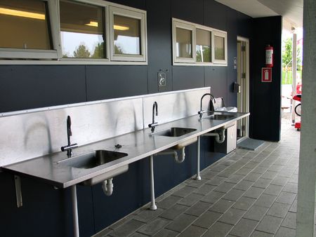 Public drinking, washing and cleaning facility in a camping siteの写真素材