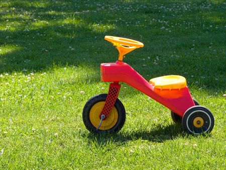 Bright colorful Tricycle standing on the grassの写真素材
